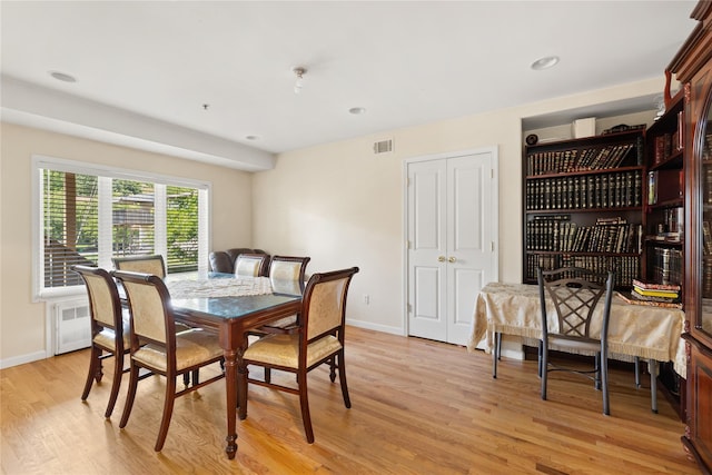 dining space with light wood-style floors, baseboards, visible vents, and recessed lighting