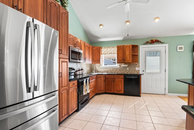 8 Rolling Woods Ln, Hampton Bays, NY 11946 - kitchen with black appliances, dark countertops, backsplash, brown cabinetry, and vaulted ceiling