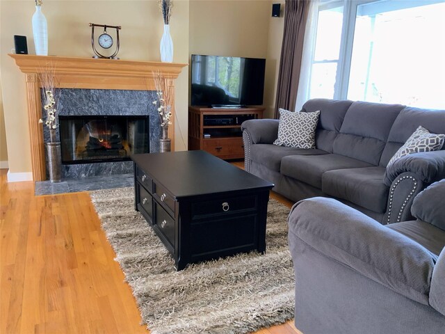 8 Rolling Woods Ln, Hampton Bays, NY 11946 - living area with wood finished floors and a high end fireplace