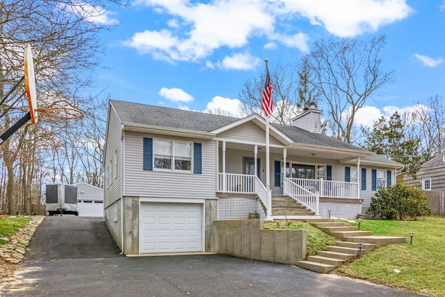 8 Rolling Woods Ln, Hampton Bays, NY 11946 - ranch-style house with a porch, a chimney, stairs, and a shingled roof