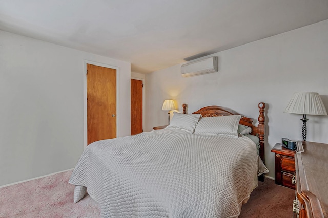 bedroom with baseboards, an AC wall unit, and carpet flooring