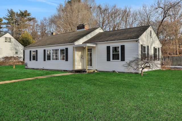 single story home with crawl space, a chimney, fence, and a front yard