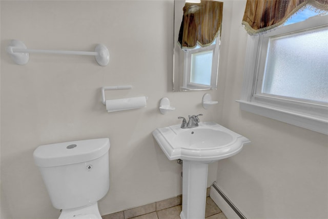 bathroom with toilet and tile patterned floors