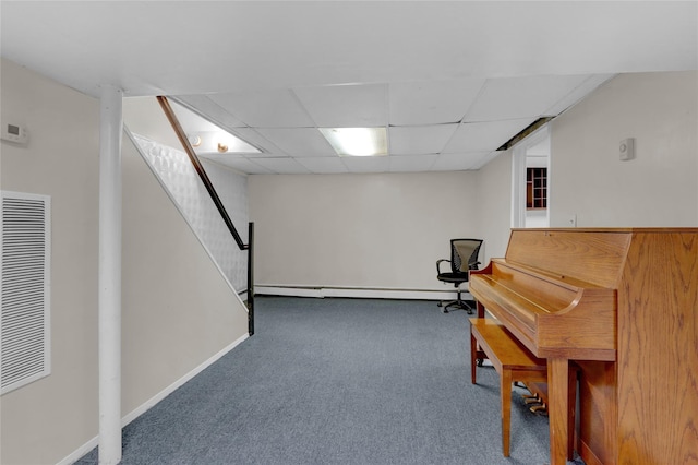 unfurnished room featuring carpet floors, a baseboard radiator, visible vents, a drop ceiling, and baseboards