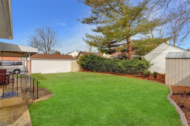 view of yard featuring an outdoor structure and a storage unit