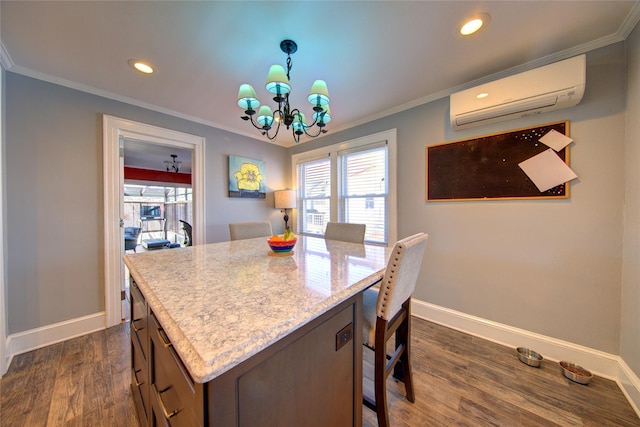 kitchen featuring a breakfast bar, crown molding, dark wood-type flooring, and an AC wall unit