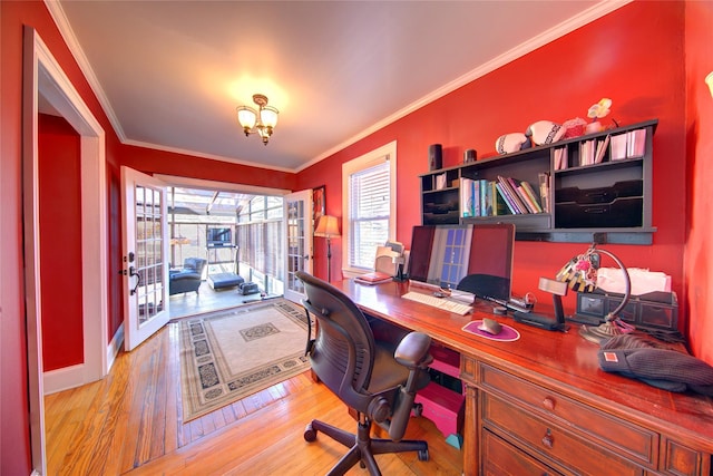 home office featuring a notable chandelier, french doors, hardwood / wood-style flooring, and crown molding