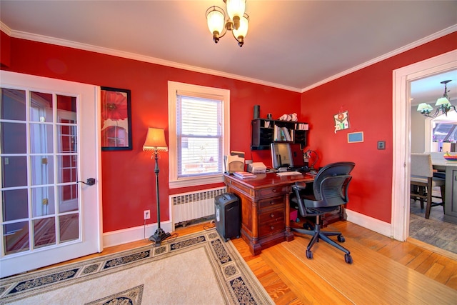 office space with a notable chandelier, radiator, ornamental molding, wood finished floors, and baseboards