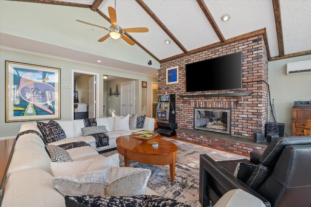 living room with lofted ceiling with beams, a textured ceiling, a ceiling fan, a wall mounted AC, and a brick fireplace