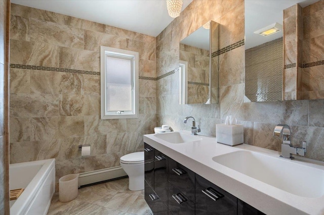 full bathroom with toilet, tile walls, baseboard heating, and a sink