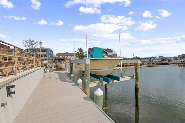 dock area featuring a water view and boat lift