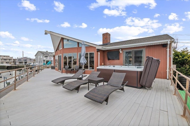 wooden terrace with a hot tub