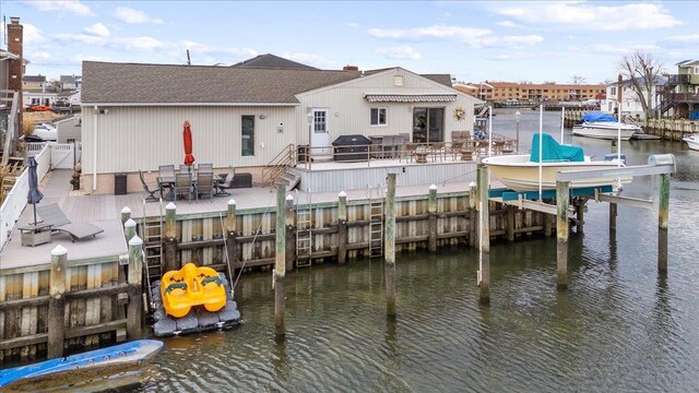 view of dock with a water view and boat lift