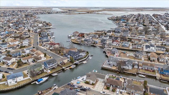 aerial view featuring a residential view and a water view