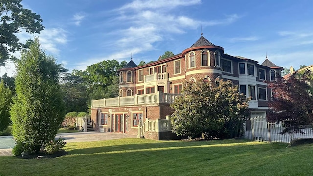 view of building exterior with fence, driveway, and an attached garage