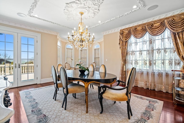 28 Whitney Cir, Glen Cove, NY 11542 - dining area with a chandelier, french doors, baseboards, and wood finished floors