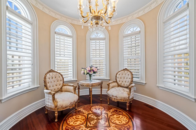 28 Whitney Cir, Glen Cove, NY 11542 - living area featuring a chandelier, baseboards, and wood finished floors