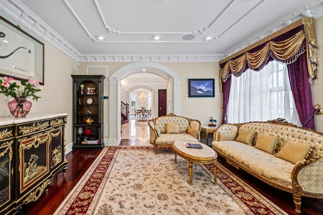 28 Whitney Cir, Glen Cove, NY 11542 - sitting room with arched walkways, baseboards, ornate columns, and dark wood-style flooring