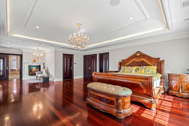28 Whitney Cir, Glen Cove, NY 11542 - bedroom featuring a raised ceiling, a premium fireplace, and a chandelier