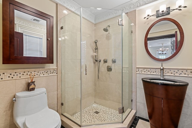 28 Whitney Cir, Glen Cove, NY 11542 - full bath with toilet, a stall shower, tile walls, wainscoting, and vanity