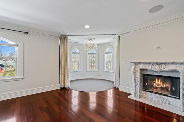 28 Whitney Cir, Glen Cove, NY 11542 - unfurnished living room featuring hardwood / wood-style flooring, a notable chandelier, a fireplace, and baseboards