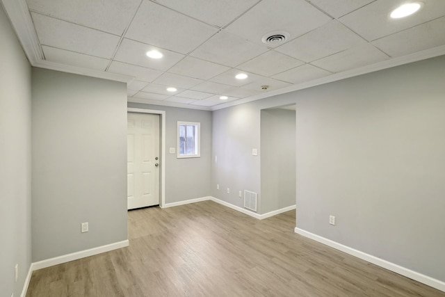 unfurnished room with recessed lighting, wood finished floors, visible vents, and baseboards