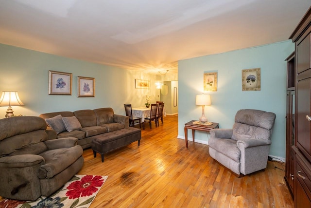 living room with light wood-style floors and baseboards