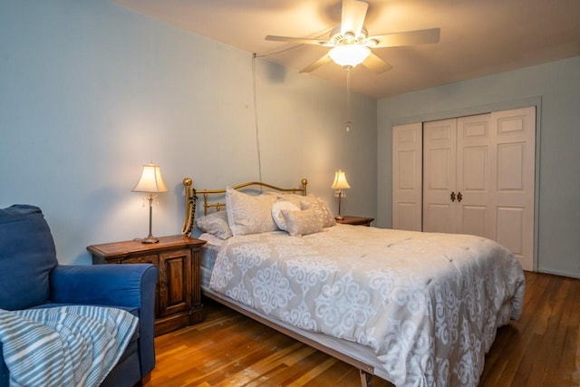 bedroom with a closet, hardwood / wood-style flooring, and a ceiling fan