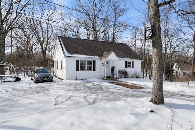 view of front of house featuring roof with shingles