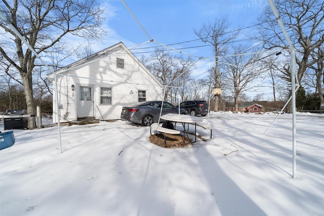 view of snow covered exterior featuring entry steps