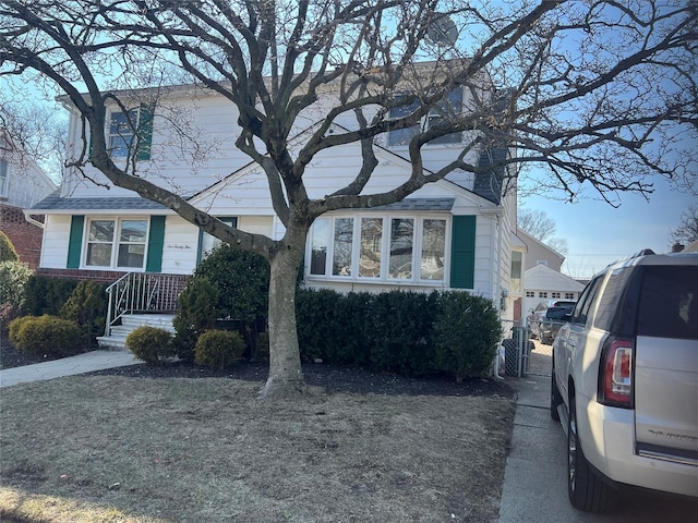 view of front of home with a gate