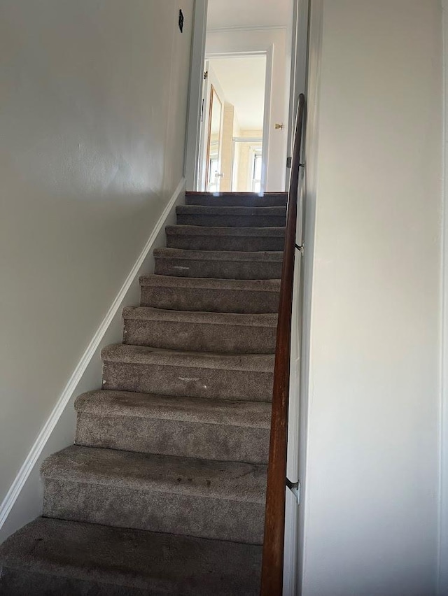 stairway with baseboards