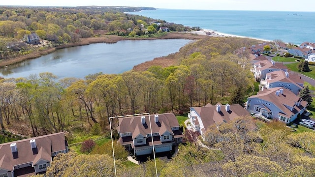 aerial view with a residential view, a water view, and a forest view