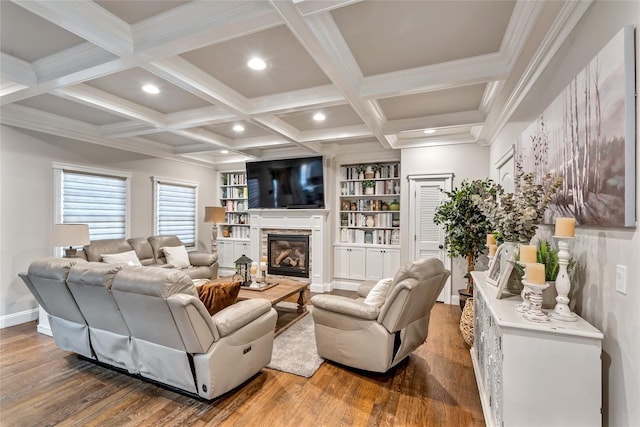 living area featuring coffered ceiling, wood finished floors, a fireplace, beam ceiling, and recessed lighting