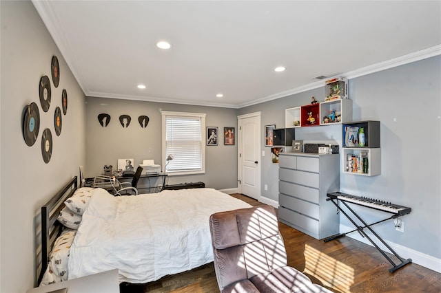 bedroom featuring ornamental molding, wood finished floors, and baseboards