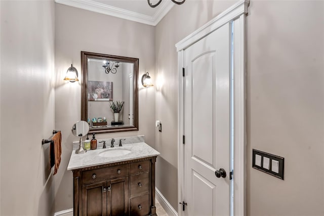 bathroom featuring crown molding and vanity