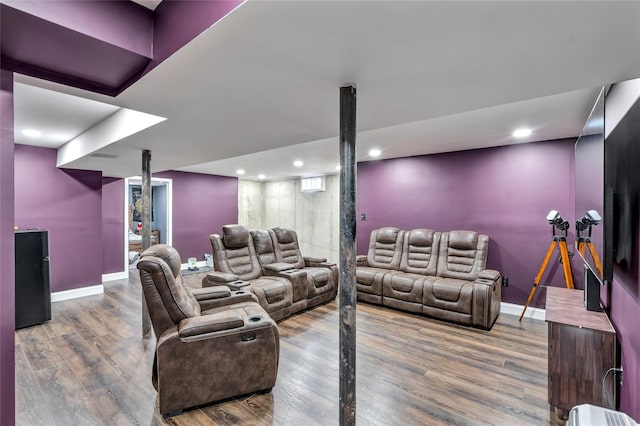 living room featuring recessed lighting, baseboards, and wood finished floors