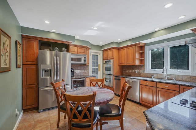 kitchen featuring wine cooler, brown cabinets, open shelves, appliances with stainless steel finishes, and a sink