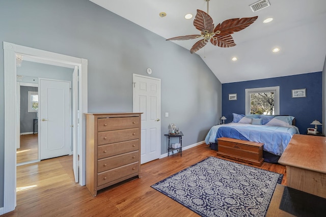 bedroom featuring high vaulted ceiling, recessed lighting, visible vents, baseboards, and light wood-style floors