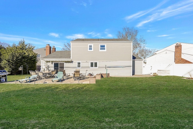 back of house featuring a patio, a yard, and fence