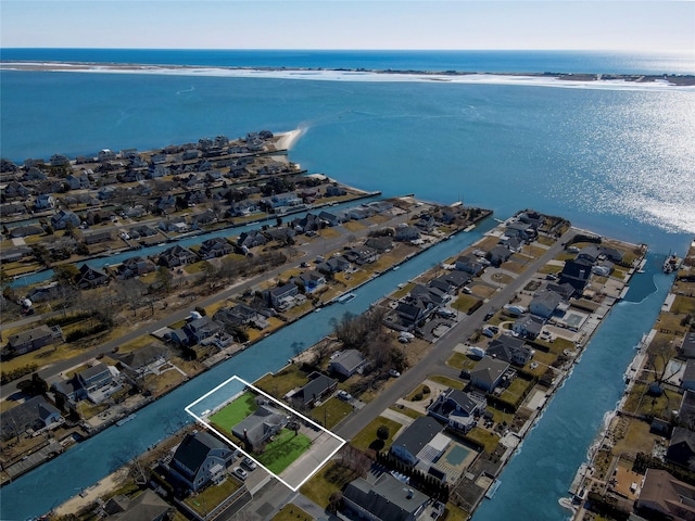 drone / aerial view with a water view and a residential view