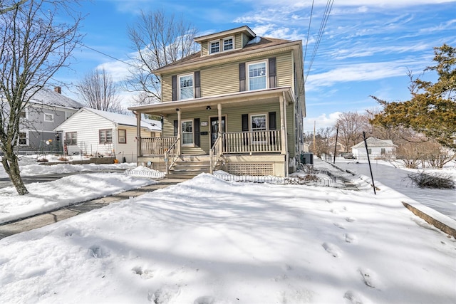 traditional style home with a porch and central AC unit