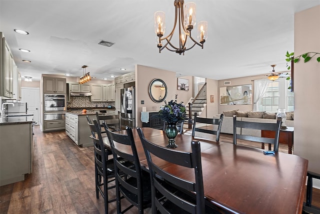 dining area with dark wood finished floors, recessed lighting, visible vents, stairway, and ceiling fan