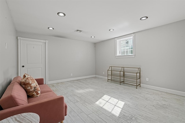 sitting room with recessed lighting, visible vents, baseboards, and wood finished floors