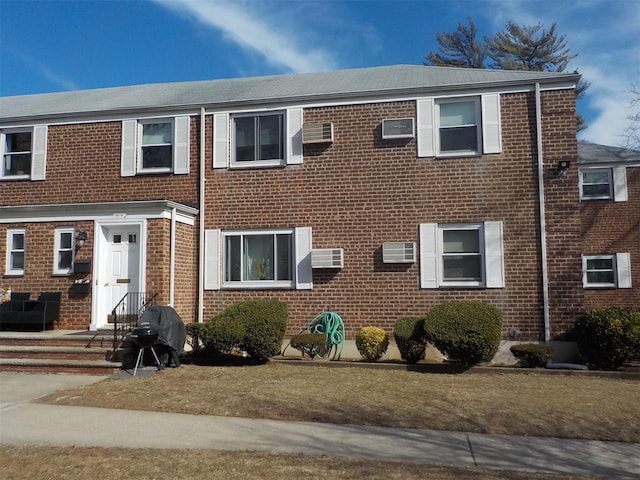 view of front facade featuring brick siding