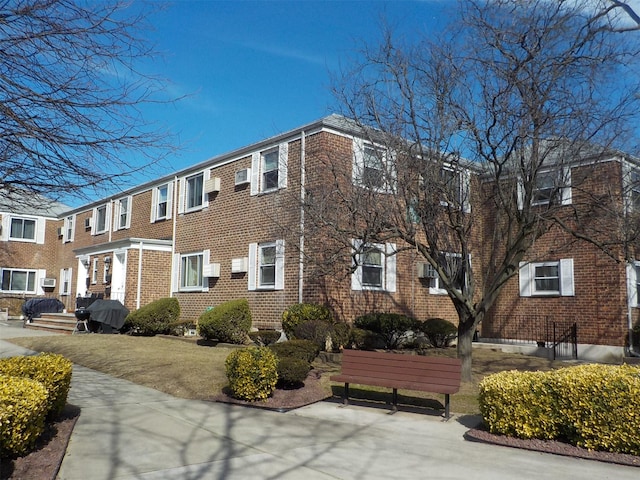 view of property exterior featuring brick siding