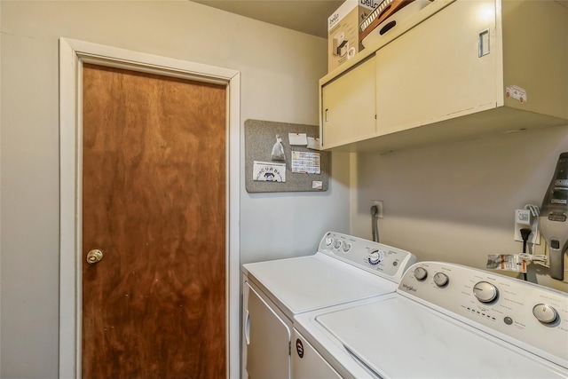 laundry room featuring cabinet space and washing machine and clothes dryer