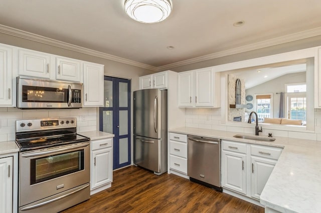 kitchen with white cabinetry, appliances with stainless steel finishes, dark wood-type flooring, and a sink