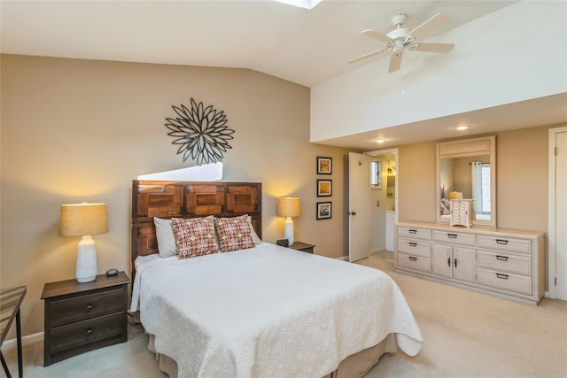 bedroom with vaulted ceiling, ceiling fan, baseboards, and light colored carpet