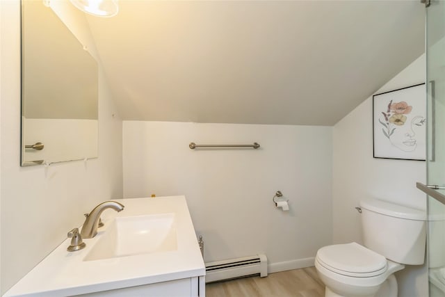 bathroom featuring a baseboard radiator, lofted ceiling, toilet, vanity, and wood finished floors